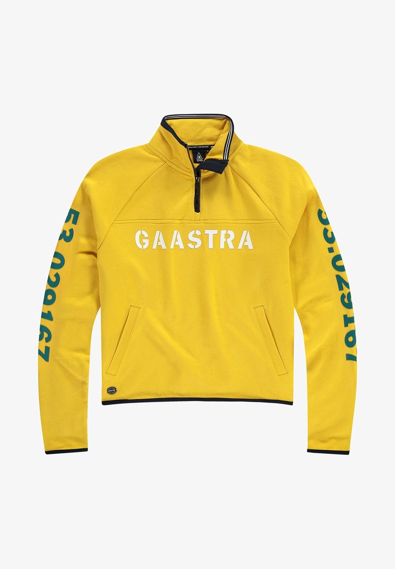 Polaire jaune à col zippé au quart, avec texte blanc "GAASTRA" et numéros bleu sarcelle sur les manches, poche latérale et accents bleu marine.