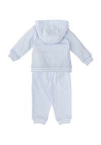 Chándal de algodón azul claro con chaqueta con capucha y pantalones. Presenta puños y dobladillo acanalados, textura suave y diseño sencillo.