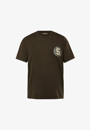 T-shirt marrone scuro in cotone, con scollatura rotonda e maniche corte. Presenta un logo circolare con la "S" sul lato sinistro del petto.