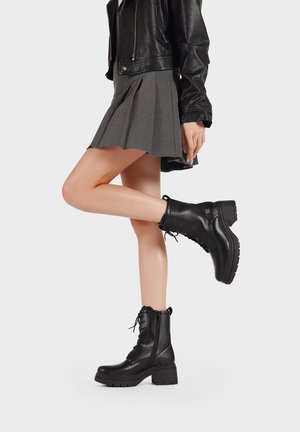 Stivaletti con plateau - nero