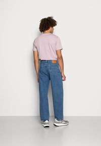 Levi's® STAY BAGGY TAPER - Calças de ganga de corte relaxado - love games