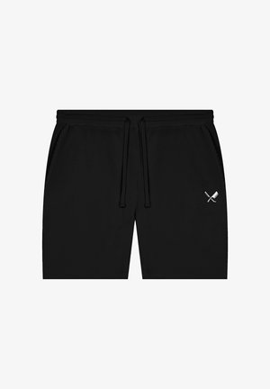 Shorts noirs à cordon avec poches latérales et un petit motif blanc d'un couteau croisé avec une hache sur la jambe droite.