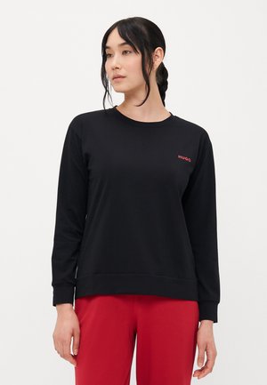 Zwart sweatshirt van zachte stof, met lange mouwen, een ronde hals en een klein rood "HUGO" logo op de linker borst.