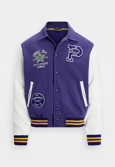 Purple varsity jacket with white sleeves, featuring embroidered tennis designs, buttons, and yellow-striped cuffs and hem.