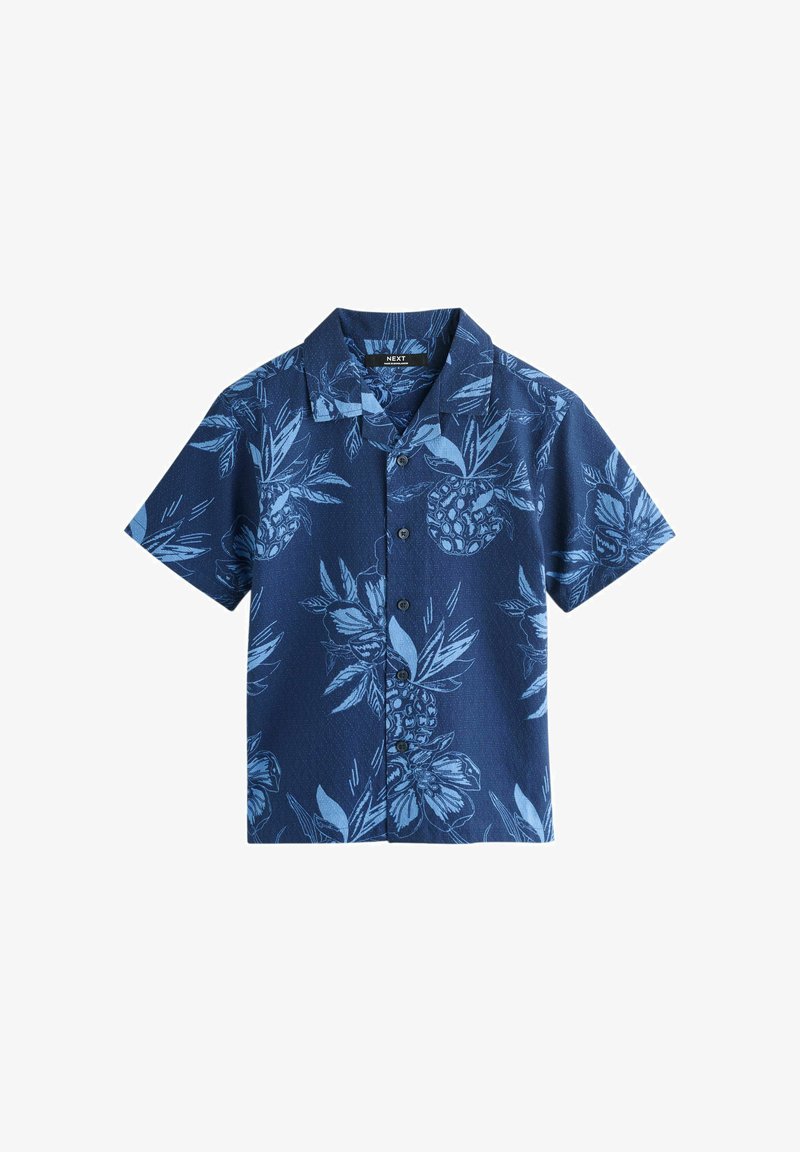 Chemise bleu marine à manches courtes avec boutons, imprimée de motifs tropicaux de feuilles et d'ananas bleu clair.
