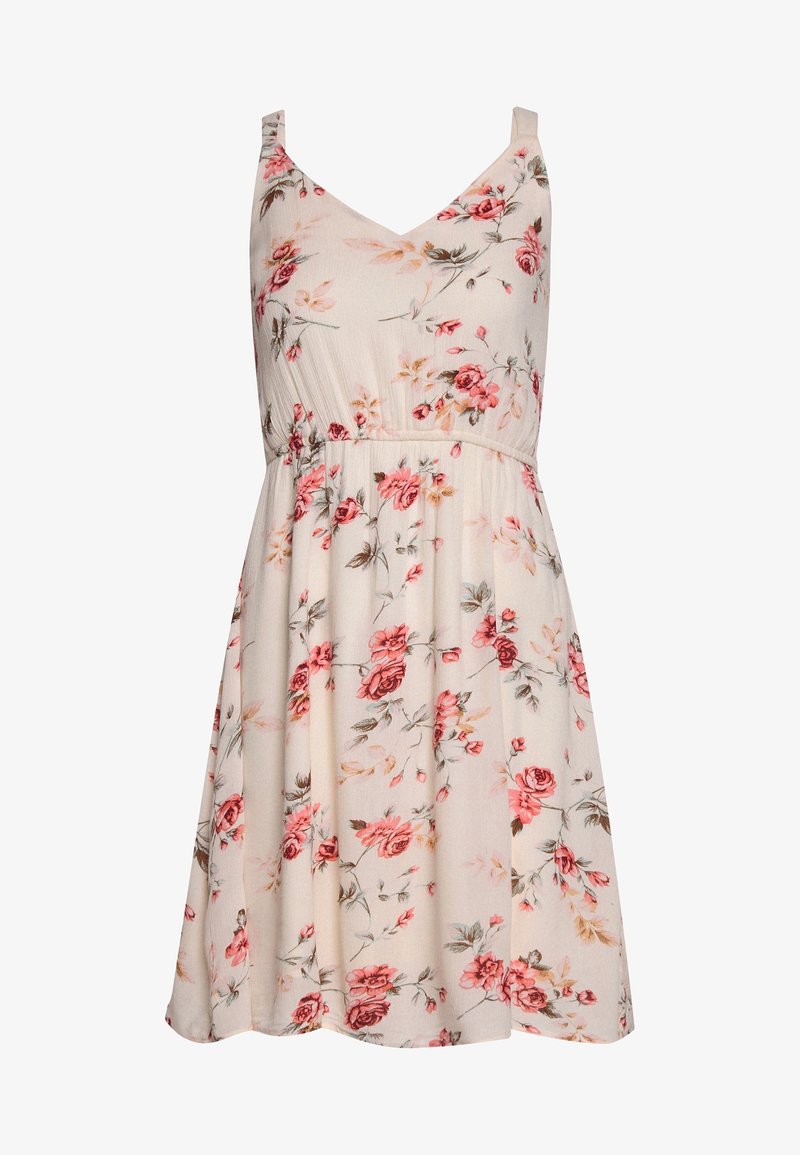 Robe florale avec un décolleté en V et de fines bretelles, présentant une base beige clair ornée de motifs floraux roses et verts. Ajustement réglable à la taille.