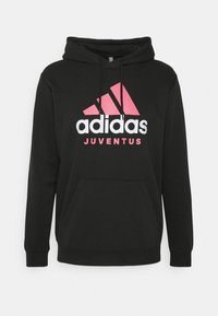 Felpa con cappuccio nera caratterizzata da tasca avante tipo kangaroo, logo Adidas rosa e bianco con il testo "JUVENTUS", realizzata in morbido materiale misto cotone.