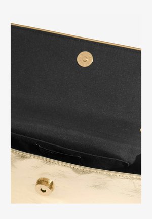 Aranyfémes kuplung táska texturált felülettel. Belsejében fekete szövet bélés található, valamint kör alakú mágneses kapocs záródás.