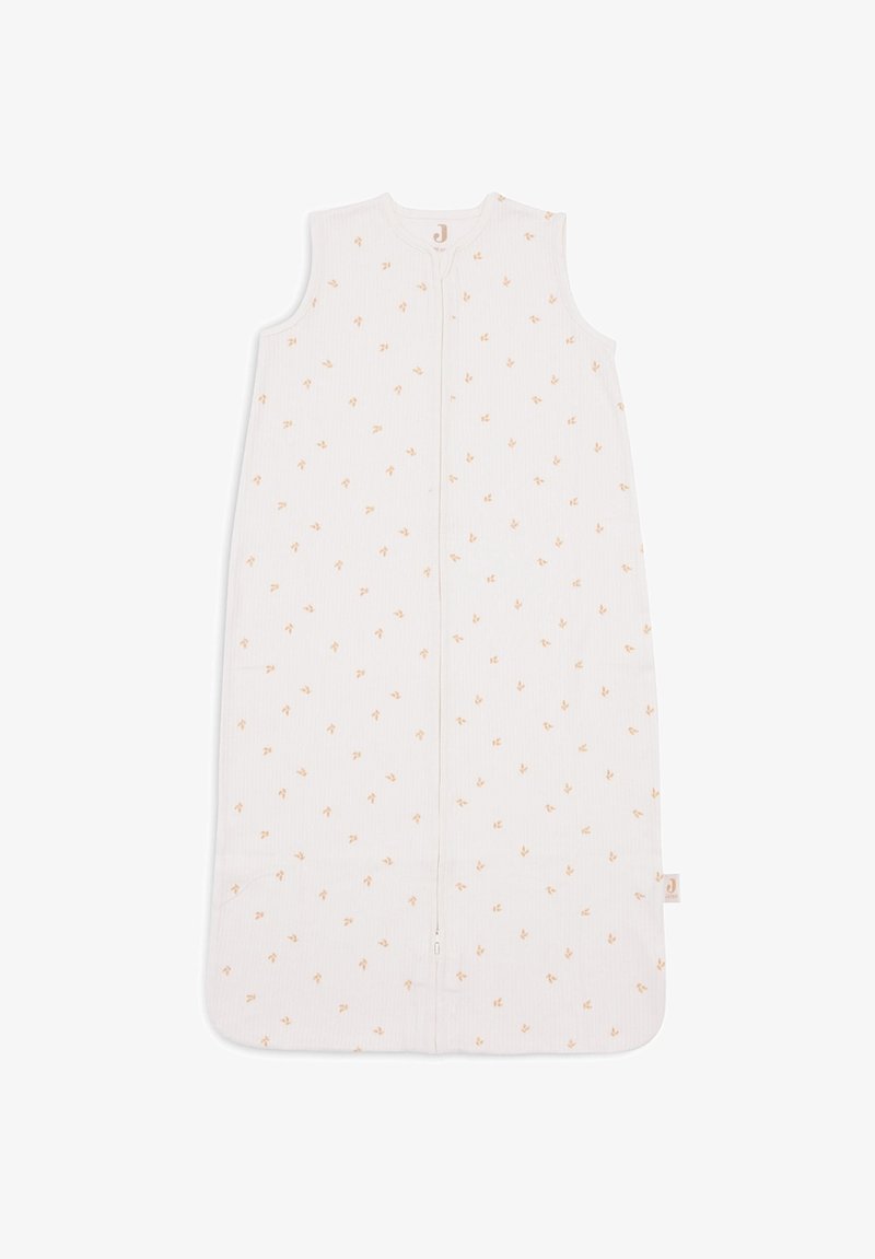 Sac de couchage sans manches en blanc avec des motifs de feuilles orange pâle, fabriqué en tissu côtelé avec une fermeture éclair à l'avant et un col rond.