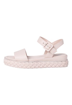 Light pink sandal with a flat sole, featuring a braided jute design and a wide strap over the foot. Buckle closure on adjustable back strap.