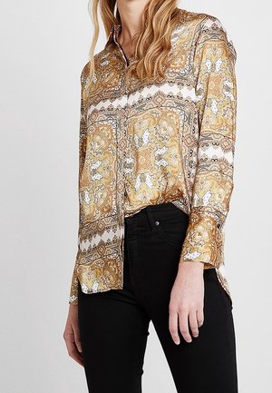 Langärmliges Hemd im goldenen Paisleymuster mit weißen und schwarzen Akzenten. Button-Down-Vorderseite, Kragen und leicht abgerundeter Saum. Weicher Stoff.