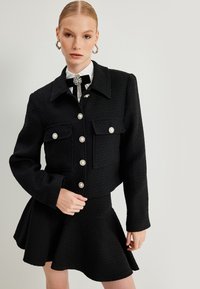 Koton Lichte jas - black