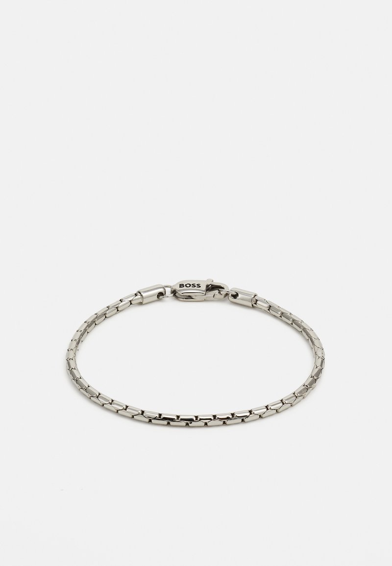 Silver metal bracelet with a linked design, featuring a clasp with the "BOSS" logo. Smooth texture and minimalistic style.