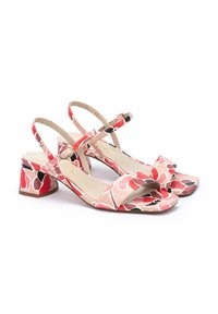 Sandali con tacco a blocco, open toe e cinturino alla caviglia, con motivo floreale rosa. La texture presenta un mix di superfici lisce ed embossed.