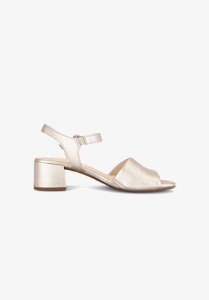 Women's metallic beige open-toe sandal with block heel, adjustable ankle strap, and smooth leather upper.