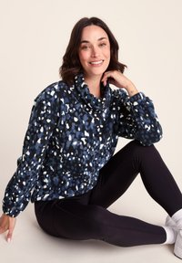 Blue and black fleece pullover with cowl neck, featuring a speckled pattern in white and light blue. Soft texture and relaxed fit.
