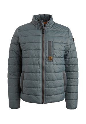 Padded gray jacket with a front zipper, high collar, and side pockets. Features quilted design and a logo patch on the chest.