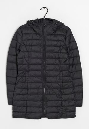 Black quilted puffer jacket with hood and front zipper, hanging on black hanger against white background.