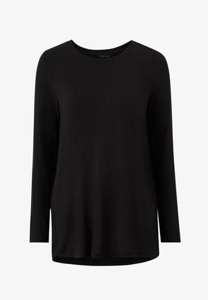 Top nero a maniche lunghe realizzato in materiale morbido, con scollo rotondo, spalle scese e orlo leggermente curvo.