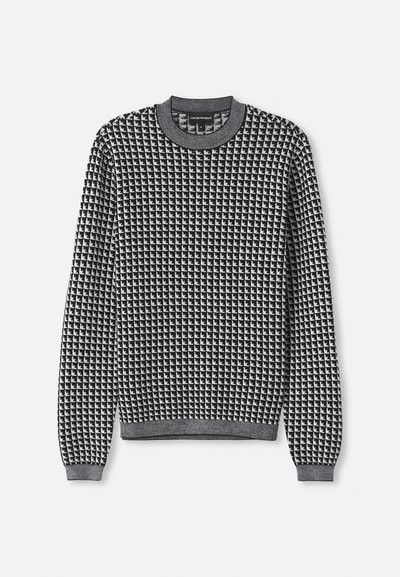 Schwarzer und weißer gemusterter Pullover mit rundem Halsausschnitt, langen Ärmeln und gerippten Bündchen. Die Textur wirkt gestrickt mit einem geometrischen Muster.