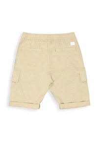 Beige cargo shorts with elastic waistband, featuring two back pockets, two side cargo pockets, and rolled hems. Smooth cotton fabric.