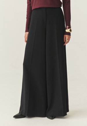 MANIKIMIA - Kalhoty - black