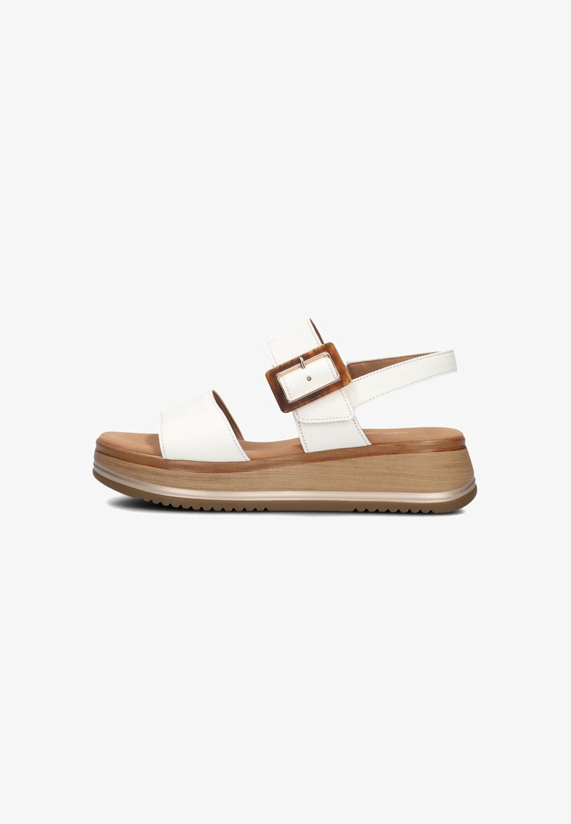 White leather sandal with two wide straps, a large brown buckle accent, and a thick wooden-textured platform sole.