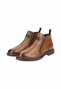 Botas de tobillo de cuero marrón con cremalleras laterales, suela de goma, puntera redondeada y acentos negros contrastantes en el tobillo. Acabado texturizado.