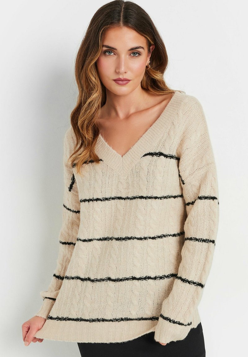 Maglione beige a maglia con scollo a V, strisce orizzontali nere, motivo a treccia e maniche lunghe. Tessuto morbido con polsini a coste.