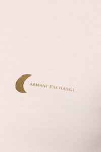 Light beige cotton t-shirt featuring a gold metallic crescent moon and “ARMANI EXCHANGE” text, with a smooth, ribbed texture.