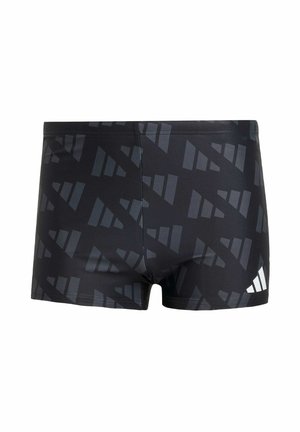 Schwarze Badehosen mit einem geometrischen grauen Muster, aus dehnbarem Material gefertigt. Sie verfügen über eine enganliegende Passform und ein kleines weißes Logo an der Seite.