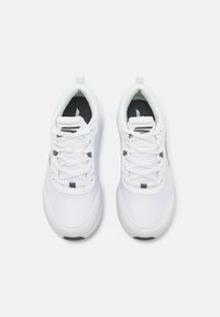 White athletic shoes featuring a mesh upper, round toe, lace-up design, and a padded collar with contrasting black accents.