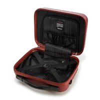 Hard-shell suitcase in red with a textured surface. Interior features black lining with compartments and straps for organization.