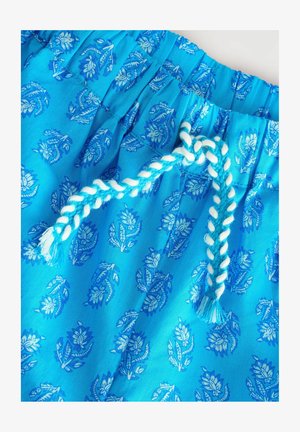 Sinised kangast lühikesed püksid, millel on elastne vöökoht. Omavad lillelist mustrit erinevates sinise toonides, mida kaunistab punutud nööri tassliidega.