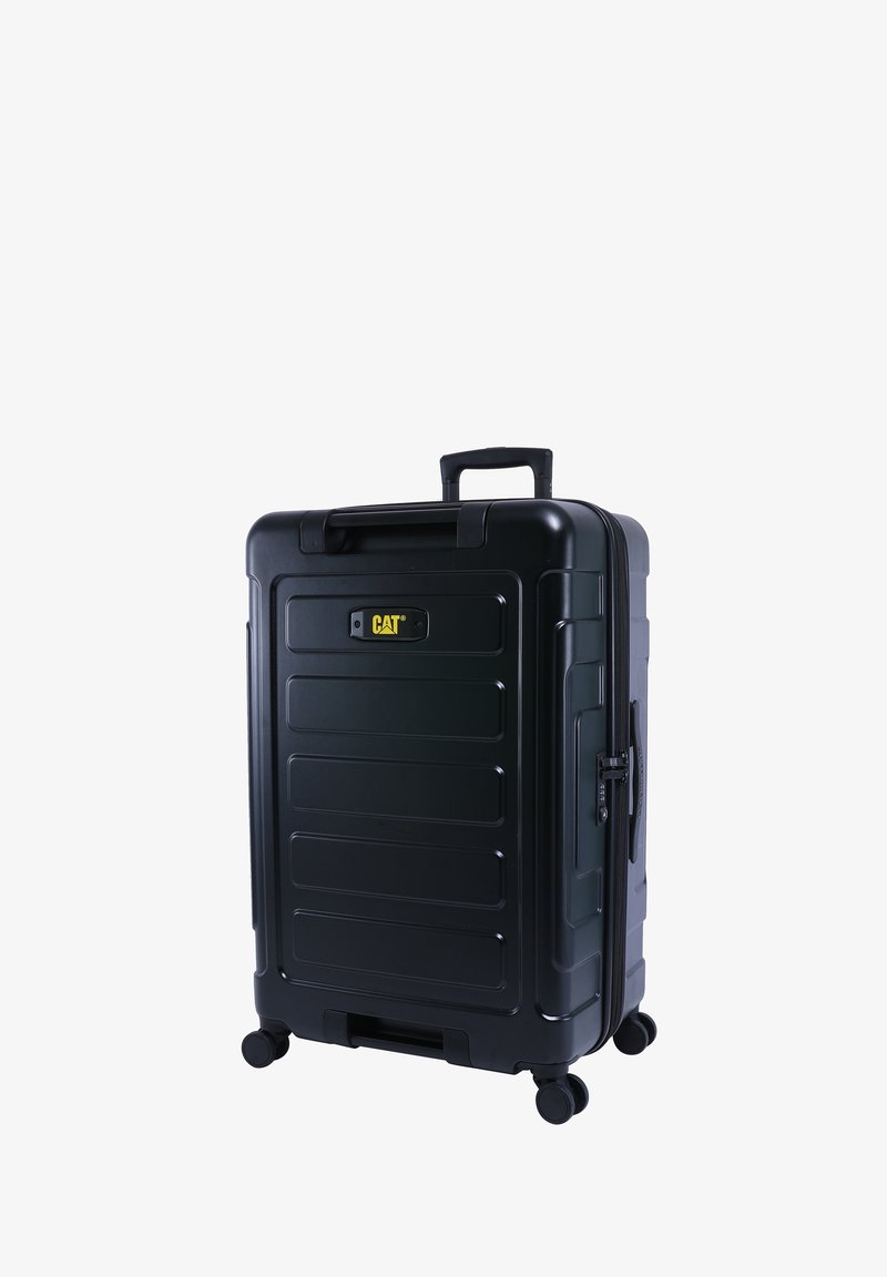 Schwarzer Hartschalenkoffer mit strukturierten Rillen, ausziehbarem Griff, Reißverschluss und vier Rädern für Mobilität. CAT-Logo deutlich sichtbar.