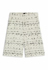 Shorts blancs en tissu texturé avec des lignes diagonales noires et des éclats. Équipés de poches latérales et d'une coupe droite.