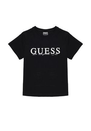 T-shirt en coton noir à manches courtes, arborant le logo blanc "GUESS Los Angeles" en caractères gras sur le devant. Encolure ronde, coupe standard.