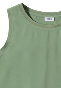 Haut sans manches vert clair avec encolure ronde et étiquette cousue indiquant CECIL à l'intérieur du col.