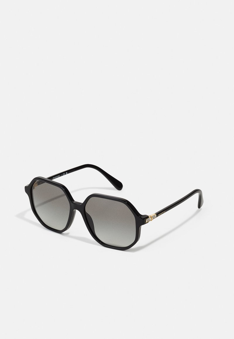 Sunglasses octogonais pretos com lentes graduadas cinzentas. Apresentam armações brilhantes e detalhes em dourado nas dobradiças.
