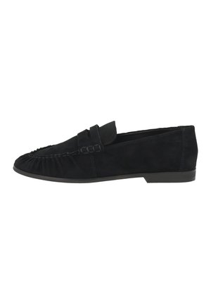 Mocasín deslizante de ante negro con costuras al estilo mocasín y suela baja y plana, mostrado de lado sobre fondo blanco.