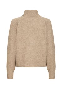 Maglione beige con collo alto, polsini e orlo a costine. Realizzato in un morbido tessuto texture con una vestibilità ampia e maniche raglan.