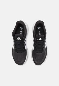 Black athletic shoes with white stripes, mesh upper for ventilation, padded collar, and a cushioned sole for comfort.