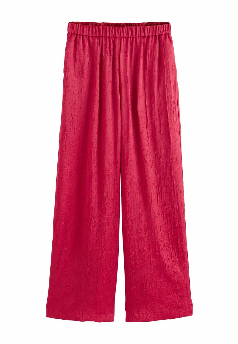Red, wide-leg pants with a crinkled texture and an elastic waistband. Made of lightweight fabric, suitable for casual wear.