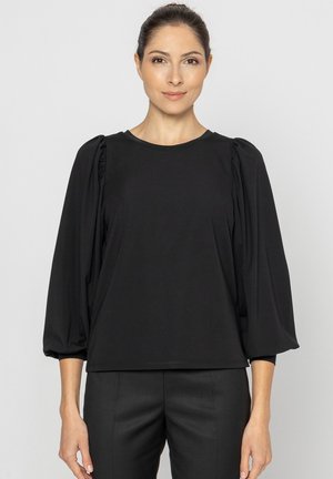 - Bluzka z długim rękawem