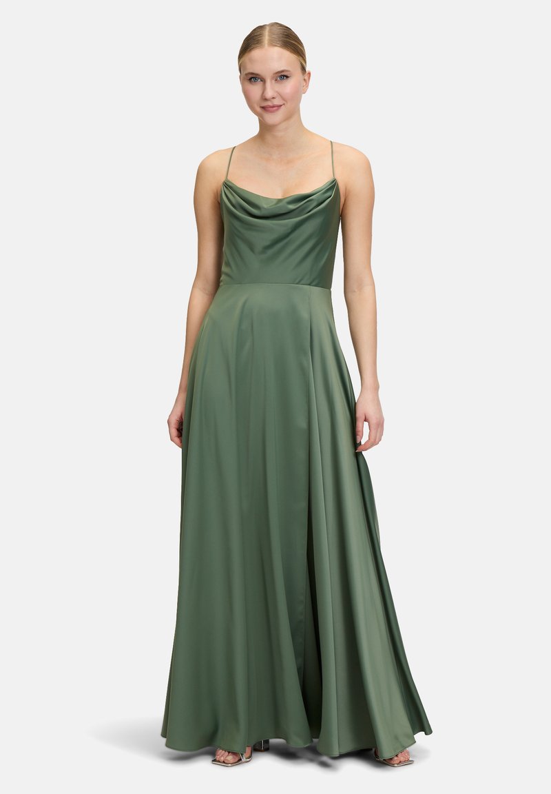Long, sleeveless green gown in smooth satin with a cowl neckline and a flowing skirt. Features thin straps and a subtle sheen.