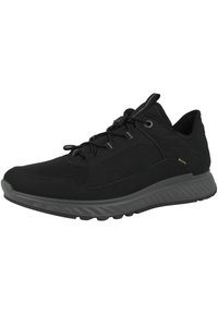 Scarpe sportive nere con una tomaia texture, design leggero, colletto imbottito e suola in gomma con lugs per una migliore aderenza.