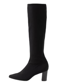 Bottes noires jusqu'au genou en tissu extensible, avec un bout pointu et un talon épais, offrant une texture lisse et un design minimal.