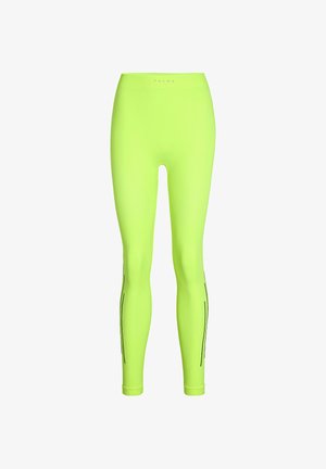 Neongrüne Leggings aus dehnbarem Stoff. Verfügt über einen hohen Bund und schwarze vertikale Nähte entlang der Beine. Glatte Textur.