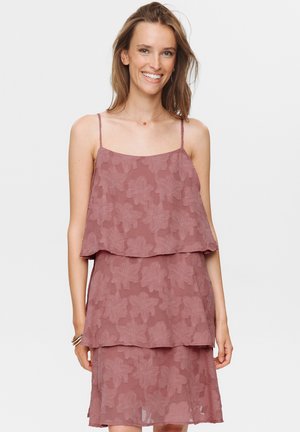 Two-layered dress with thin straps, in mauve color featuring a floral pattern. The fabric appears lightweight and slightly textured.