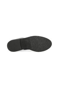 Suela de zapato negra con agarre de goma texturizada, presenta un borde curvado y una superficie plana y sólida. Marca estampada visible cerca del talón.